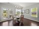 Bright breakfast nook featuring hardwood floors, modern lighting, and access to outdoor patio at 215 Center Hill Ct, Summerville, SC 29485