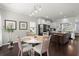 Open-concept breakfast nook showcasing modern lighting, kitchen island, and stainless steel appliances at 215 Center Hill Ct, Summerville, SC 29485