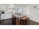 Granite kitchen island with modern stools, and cabinets at 215 Center Hill Ct, Summerville, SC 29485