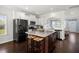 Open-concept kitchen with a granite island and stainless steel appliances at 215 Center Hill Ct, Summerville, SC 29485