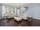 Bright living room featuring hardwood floors, plush seating, and natural light at 215 Center Hill Ct, Summerville, SC 29485