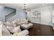 Relaxing living room boasts hardwood floors and comfortable seating at 215 Center Hill Ct, Summerville, SC 29485