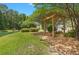 Relaxing swing set beside a tranquil pond, with lush landscaping providing shade and privacy at 215 Center Hill Ct, Summerville, SC 29485
