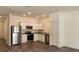 Modern kitchen features stainless steel appliances and beautiful stone countertops at 2402 Scarlett Maple St, Summerville, SC 29486