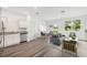A bright living room features hard wood floors, plenty of light, and modern decor at 2402 Scarlett Maple St, Summerville, SC 29486