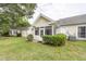 Backyard with lawn, bushes and enclosed porch at 2441 Hansard Dr, North Charleston, SC 29406