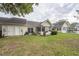 Backyard featuring well-maintained lawn and an enclosed porch at 2441 Hansard Dr, North Charleston, SC 29406