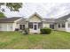 Backyard featuring well-maintained lawn and an enclosed porch at 2441 Hansard Dr, North Charleston, SC 29406