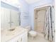Bathroom with vanity, toilet, and shower with white tile and a modern shower curtain at 2441 Hansard Dr, North Charleston, SC 29406