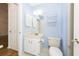 Blue bathroom with vanity, toilet, and shelving at 2441 Hansard Dr, North Charleston, SC 29406