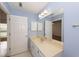Bathroom with large mirror and vanity, light blue walls, and white trim at 2441 Hansard Dr, North Charleston, SC 29406