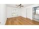 Bright bedroom featuring hardwood floors, a ceiling fan, and an ensuite bathroom at 2441 Hansard Dr, North Charleston, SC 29406