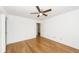 Bedroom with ceiling fan and hardwood floors that leads to ensuite and closets at 2441 Hansard Dr, North Charleston, SC 29406