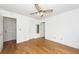 Bedroom with hardwood floors, ceiling fan, and access to closet and ensuite at 2441 Hansard Dr, North Charleston, SC 29406