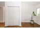 Bright foyer with white walls, closet with folding doors, and wood floors that add warmth at 2441 Hansard Dr, North Charleston, SC 29406