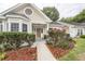 Charming one-story home featuring a well-manicured yard, covered porch, and a welcoming entrance at 2441 Hansard Dr, North Charleston, SC 29406