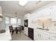 Open kitchen flowing into the dining area, featuring modern appliances and ample counter space at 2441 Hansard Dr, North Charleston, SC 29406