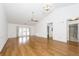 Spacious living room with hardwood floors, high ceilings, and natural light streaming through sliding doors at 2441 Hansard Dr, North Charleston, SC 29406