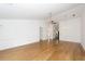 Open living room with vaulted ceilings, hardwood floors, ceiling fan and neutral paint at 2441 Hansard Dr, North Charleston, SC 29406