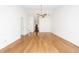 Spacious living room with hardwood floors, modern ceiling fan and light fixture at 2441 Hansard Dr, North Charleston, SC 29406