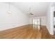 Bright living room featuring hardwood floors, ceiling fan, and sliding glass doors to the backyard at 2441 Hansard Dr, North Charleston, SC 29406