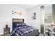 Vibrant bedroom with stylish decor, including a bed with blue accents and fun wall art at 257 Wild Strawberry Ln, Moncks Corner, SC 29461