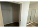 View of a walk in closet adjacent to a shower behind a sliding glass door at 260 Wild Strawberry Ln, Moncks Corner, SC 29461