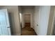Hallway with wood flooring and white doors leading to various rooms at 260 Wild Strawberry Ln, Moncks Corner, SC 29461