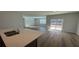 Modern kitchen with stainless steel sink, quartz countertop, and sliding doors to the outdoor patio at 260 Wild Strawberry Ln, Moncks Corner, SC 29461