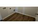 Laundry room with wood flooring, a utility sink connection and connections for a washer and dryer at 260 Wild Strawberry Ln, Moncks Corner, SC 29461