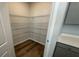 Well-organized walk-in pantry with wire shelving and wood-look flooring, offering ample storage at 260 Wild Strawberry Ln, Moncks Corner, SC 29461