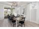 Elegant dining room features a modern chandelier, large windows, and an open floor plan at 267 Garden Gate Way, Summerville, SC 29486