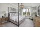 A main bedroom with neutral décor, large windows for natural light, and stylish furnishings at 267 Garden Gate Way, Summerville, SC 29486