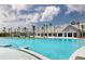 Expansive pool area with fountains, palm trees, and a view of the clubhouse at 267 Garden Gate Way, Summerville, SC 29486