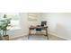 Bright office featuring a dark wood desk, blue chair, and lots of natural light at 267 Wild Strawberry Ln, Moncks Corner, SC 29461