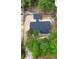 Aerial view shows the new house and garage situated on a private lot with mature trees at 277 W Smith St, Lincolnville, SC 29485