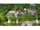 An aerial view shows a beautiful treed building lot with a new home and garage at 277 W Smith St, Lincolnville, SC 29485