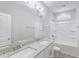 Bright bathroom with a double vanity and shower-tub combo at 277 W Smith St, Lincolnville, SC 29485