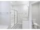 Bright bathroom featuring a glass door shower and single vanity at 277 W Smith St, Lincolnville, SC 29485