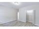 Clean bedroom featuring light grey floors and an open closet at 277 W Smith St, Lincolnville, SC 29485