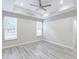 Relaxing bedroom with a ceiling fan and tray ceiling detail at 277 W Smith St, Lincolnville, SC 29485