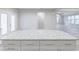 Modern kitchen with white cabinets, granite countertops, stainless appliances and light-colored wood flooring at 277 W Smith St, Lincolnville, SC 29485