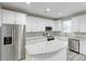 Bright kitchen with white cabinets, stainless steel appliances, granite countertops and light-colored wood flooring at 277 W Smith St, Lincolnville, SC 29485
