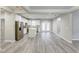 Modern kitchen with white cabinets, stainless steel appliances, granite countertops and light-colored wood flooring at 277 W Smith St, Lincolnville, SC 29485