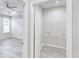 Neat laundry room featuring gray floors and shelving for storage at 277 W Smith St, Lincolnville, SC 29485