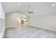 Open-concept living space with vaulted ceiling, modern floors, and easy access to the kitchen at 277 W Smith St, Lincolnville, SC 29485