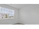 Sunlight fills this simple bedroom with plank flooring and a large window at 293 Blue Haw Dr, Moncks Corner, SC 29461