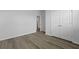 A new bedroom with plank flooring features a hallway and closet at 293 Blue Haw Dr, Moncks Corner, SC 29461