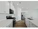 Spacious kitchen with white cabinetry, stainless steel appliances, and a large center island at 293 Blue Haw Dr, Moncks Corner, SC 29461