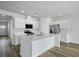 Bright kitchen featuring white cabinets, stainless steel appliances, and a center island at 293 Blue Haw Dr, Moncks Corner, SC 29461